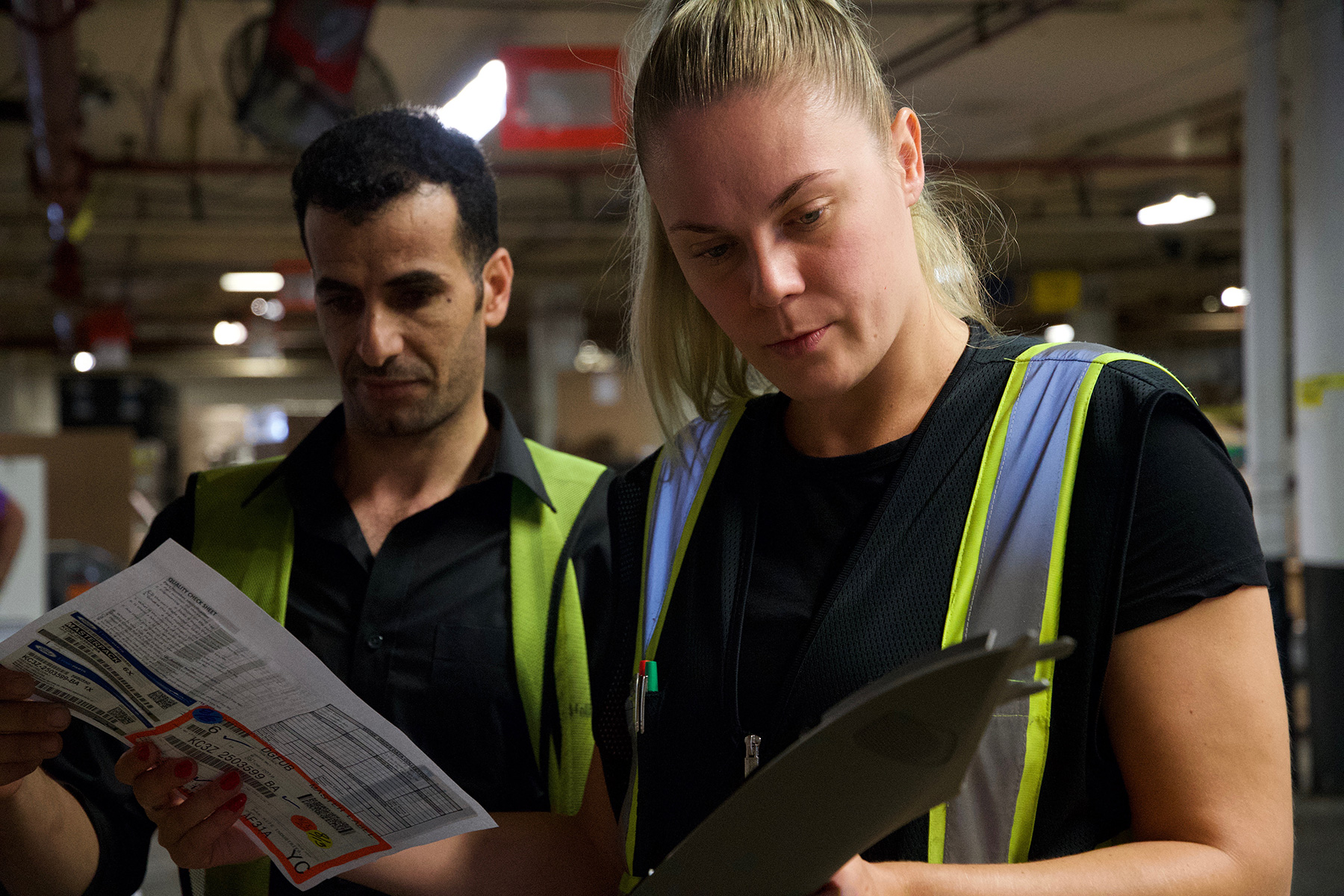 woman checking warehouse parts