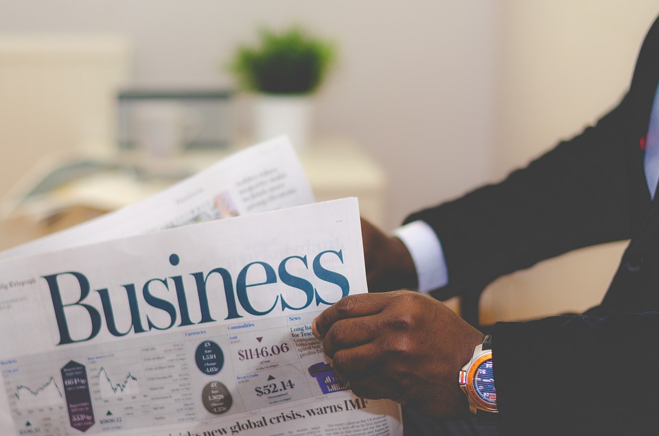 man reading business newsletter